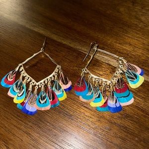 Kendra Scott statement feather earrings, gold but feathers are different colors